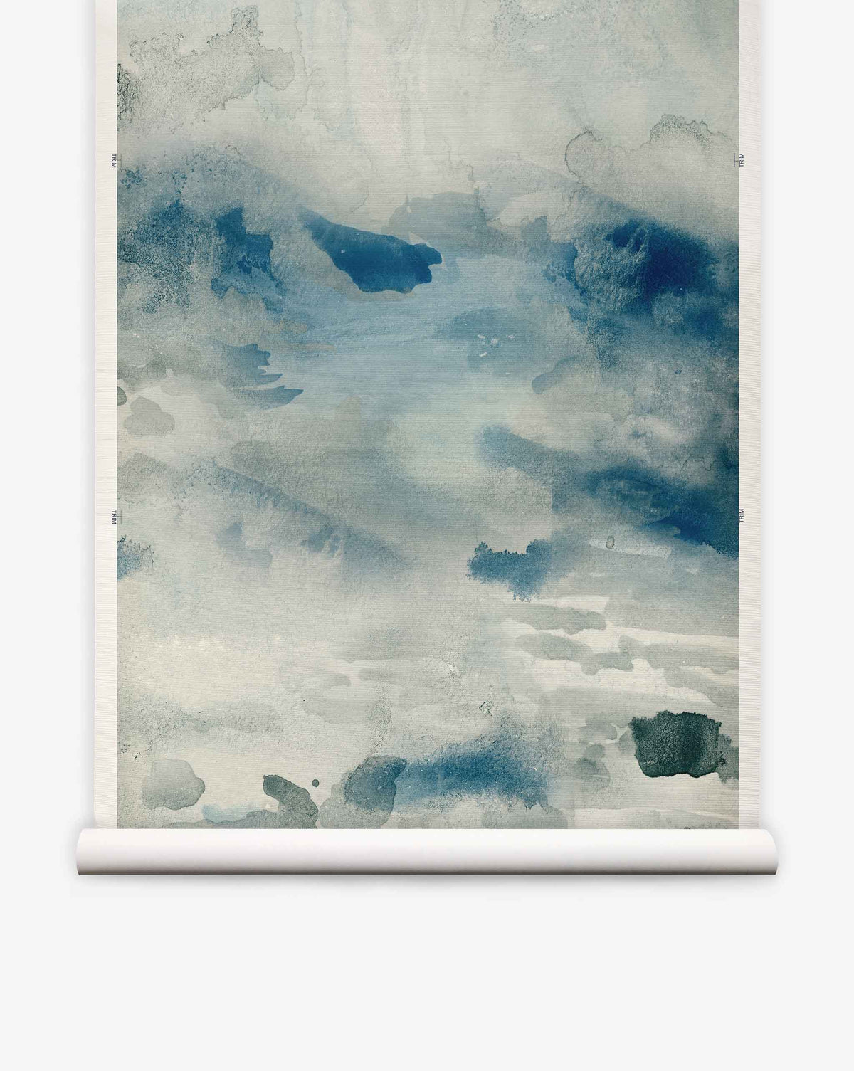 The Empyrean Grasscloth Mural||Cyrrus features abstract watercolor artistry in blue and gray tones, evoking a misty landscape or tranquil water scene—beautifully presented on a white scroll frame. This luxury mural is perfect for creating striking, sophisticated interiors, whether used as an elegant wallcovering or dramatic watercolor wallpaper.