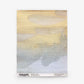 A rectangular mural featuring horizontal brushstrokes in shades of beige, yellow, gray, and blue. “Empyrean Grasscloth Sample || Dawn” from ESKAYEL with product details is printed along the bottom edge. Order a sample to experience the colors and textures firsthand.