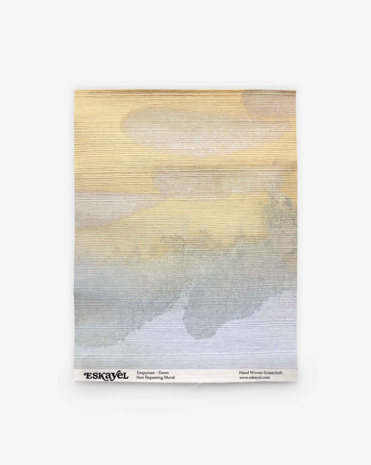A rectangular mural featuring horizontal brushstrokes in shades of beige, yellow, gray, and blue. “Empyrean Grasscloth Sample || Dawn” from ESKAYEL with product details is printed along the bottom edge. Order a sample to experience the colors and textures firsthand.