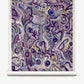 Floripa Grasscloth||Pomegranate features an abstract design with swirling purple, blue, and gray shapes and patterns displayed on a crisp white scroll. Various curved lines and forms create a textured, layered composition reminiscent of luxury wallpaper—perfect for spaces inspired by surf culture or an Eskayel collaboration aesthetic.