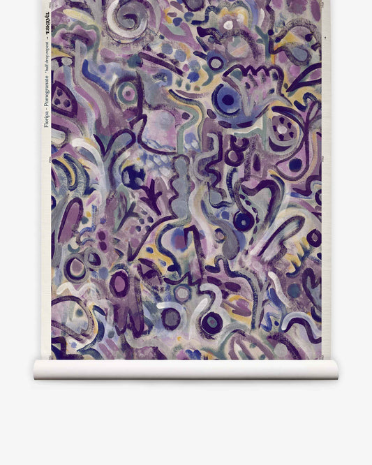 Floripa Grasscloth||Pomegranate features an abstract design with swirling purple, blue, and gray shapes and patterns displayed on a crisp white scroll. Various curved lines and forms create a textured, layered composition reminiscent of luxury wallpaper—perfect for spaces inspired by surf culture or an Eskayel collaboration aesthetic.