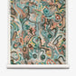 Floripa Grasscloth||Reef features an abstract design with swirling shapes, lines, and dots in earthy tones of green, blue, orange, and brown on a white scroll background, capturing the vibrant energy of multicolor wallpaper inspired by Brazilian folklore.