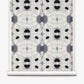 Galileo Glass Grasscloth||Indigo features an abstract black and gray symmetrical pattern reminiscent of ink blots, repeated across a white textured background with a visible paper roll edge. This exquisite wallpaper evokes the refined aesthetic of luxurious grasscloth, lending sophisticated texture and visual intrigue to any interior.