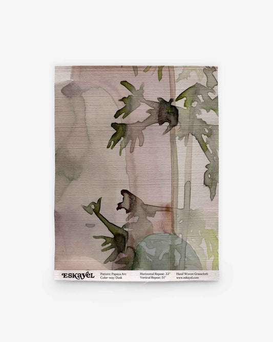 A rectangular Papaya Arc Grasscloth Sample in Dusk featuring a watercolor painting of green papaya leaves against a light purple and beige striped background.