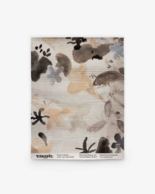 A square rug sample of the Pétalos Grasscloth||Sand Dollar, featuring an abstract floral watercolor design in neutral tones that evokes an ink-wash aesthetic, is labeled with pattern, color, and repeat details, along with the Eskayel brand logo at the bottom.