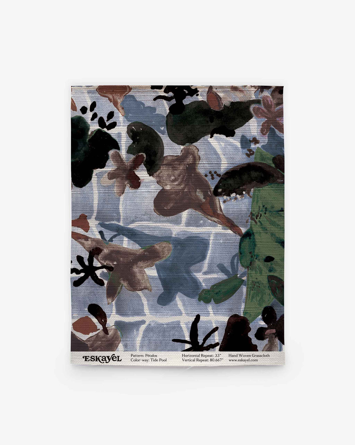 Introducing the Pétalos Grasscloth Sample | Tide Pool: This patterned textile showcases abstract brown, green, and black shapes layered over a blue and white grid background, displayed on a white surface with a label at the bottom. Ideal for distinctive projects—order your sample today to experience its quality and design firsthand.