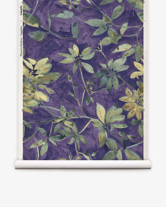 Add lush, modern style to any room with the Plumeria Shadows Grasscloth||Eggplant wallpaper—a roll featuring a botanical pattern of green and yellow leaves set against an eye-catching eggplant purple background, inspired by tropical wallpaper design.