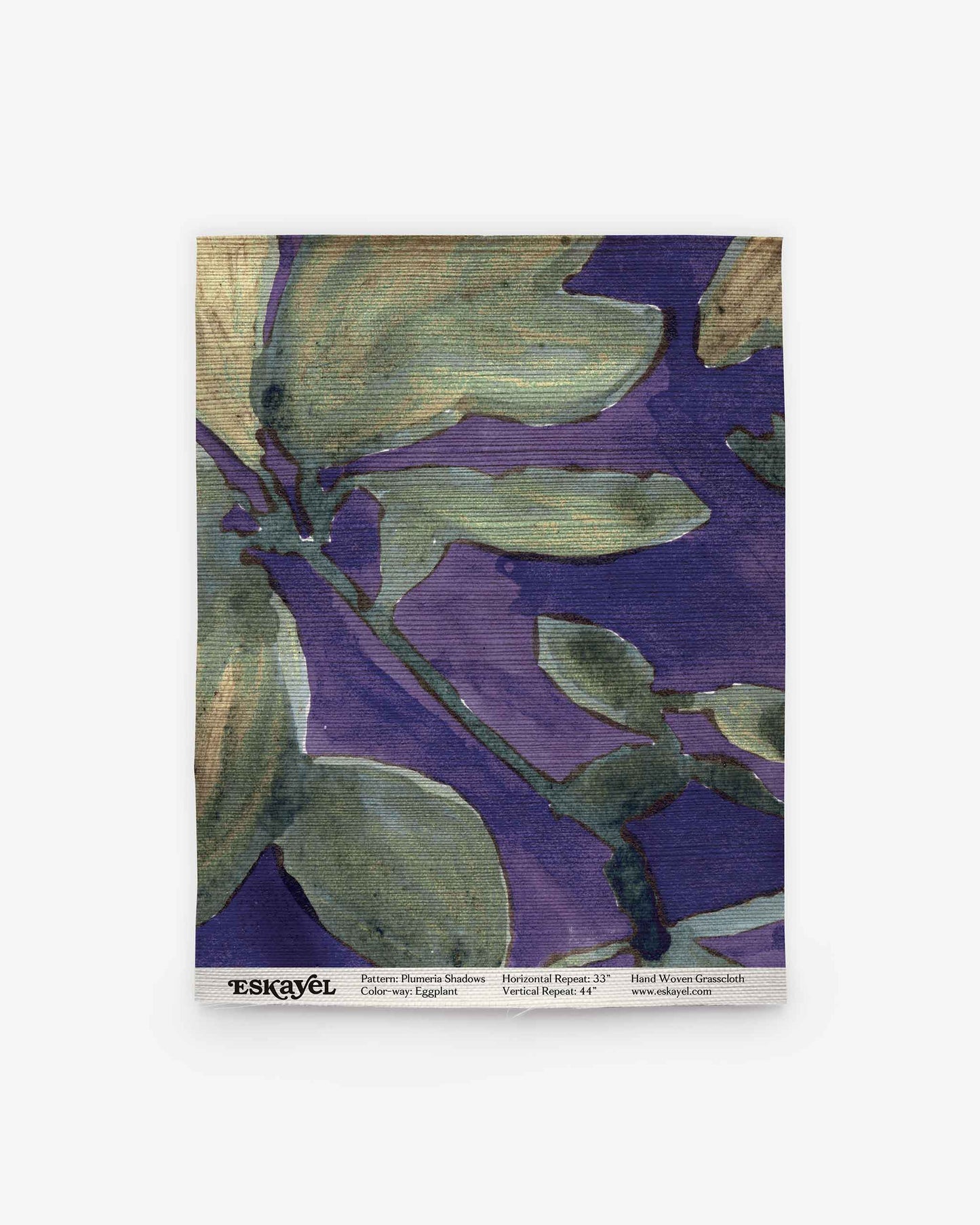 Square swatch of fabric featuring the Plumeria Shadows Grasscloth pattern in Eggplant, with abstract floral designs in green and purple hues. The bottom edge is marked with “ESKAYEL” and includes pattern and dimension details. Perfect for exploring your next project—Order a sample to experience the unique texture and vibrant colors firsthand.