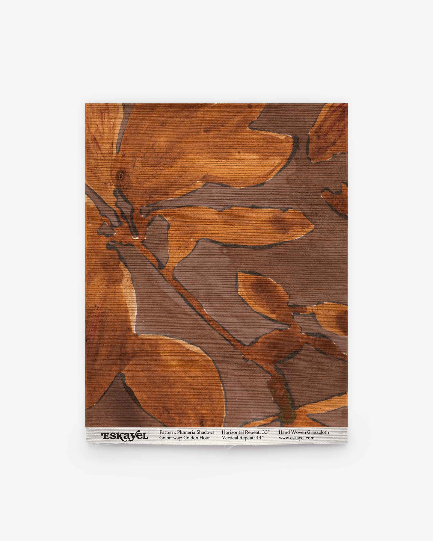 Square tile featuring the Plumeria Shadows Grasscloth Sample in Golden Hour, showcasing a brown and orange abstract floral pattern with text along the bottom edge. Order a sample to experience this unique design firsthand.
