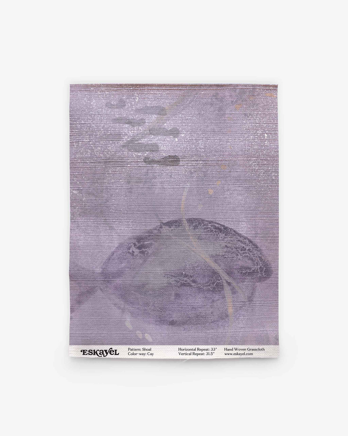 A square fabric sample of Shoal Grasscloth Sample in the Cay colorway, showcasing a muted purple and gray palette with subtle abstract shapes. Text at the bottom lists pattern, color, and dimensions. Order your Shoal Grasscloth Sample today to experience its design and quality firsthand.