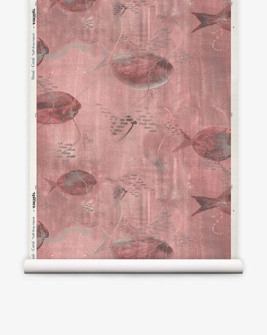 Shoal Grasscloth||Coral wallpaper roll with a pink and mauve fish and stingray design, featuring schools of small fish on a textured background for a dreamy watercolor aesthetic.