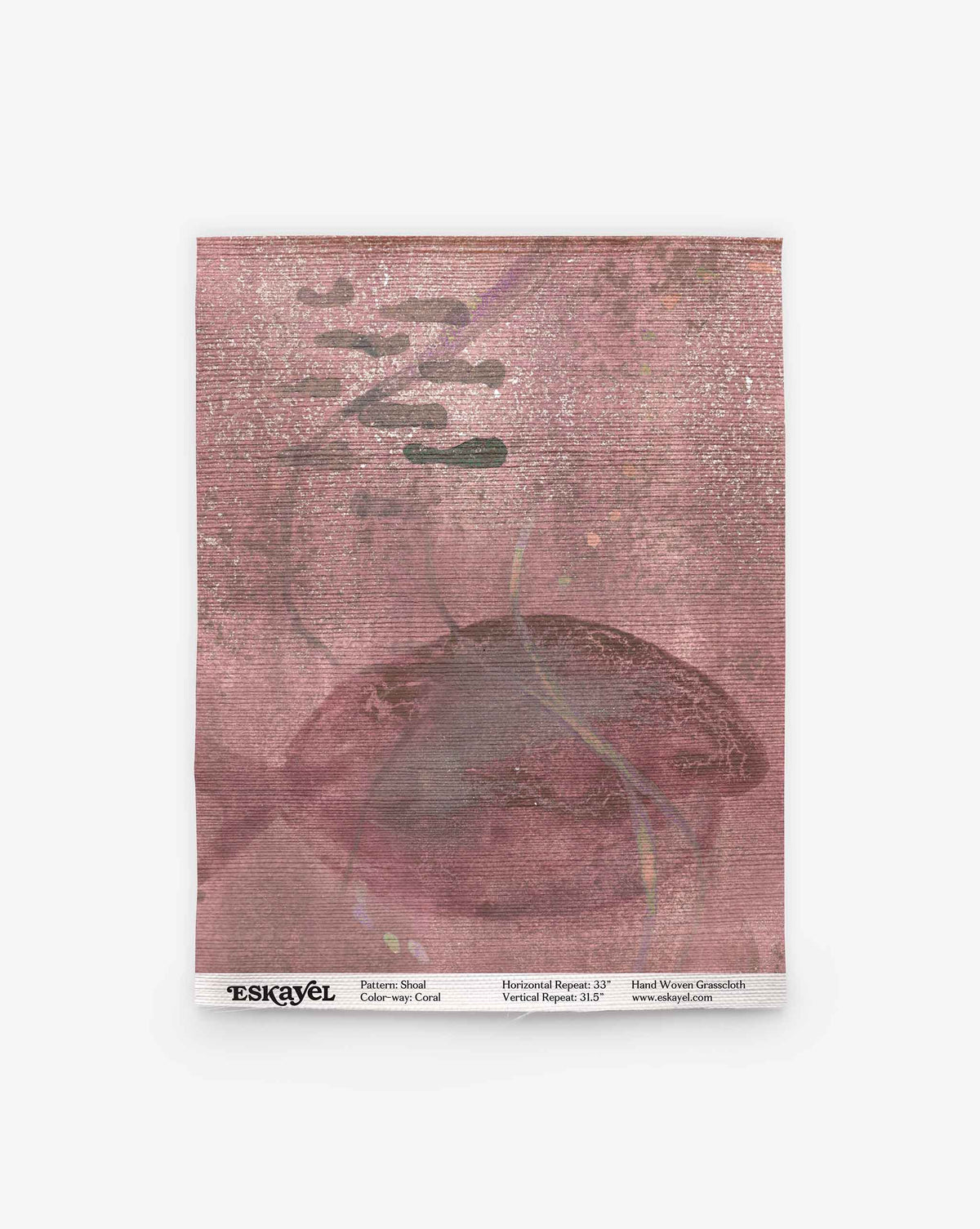 A pink textured square featuring abstract cloud shapes and a subtle fish motif; the label at the bottom reads “ESKAYEL” along with pattern details. Order a Shoal Grasscloth Sample in Coral to experience this unique design firsthand.