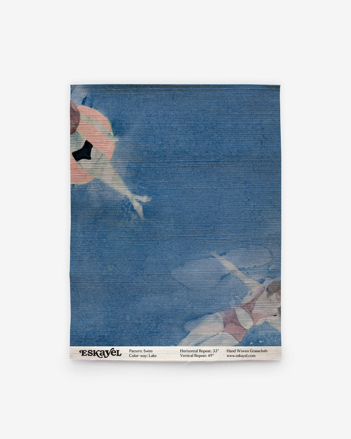 Swim Grasscloth||Lake blue coastal wallpaper featuring a watercolor illustration of two figures swimming in a pool, with product information printed along the bottom edge.