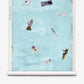 Swim Grasscloth||Sea coastal wallpaper featuring an illustration of people swimming and floating on pool floats in light blue water.