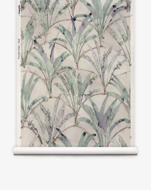 Travelers Palm Grasscloth||Dusk hand-woven wallpaper featuring a watercolor pattern of palm leaves over a faint, scalloped grid in shades of green and purple on a neutral biophilic background.