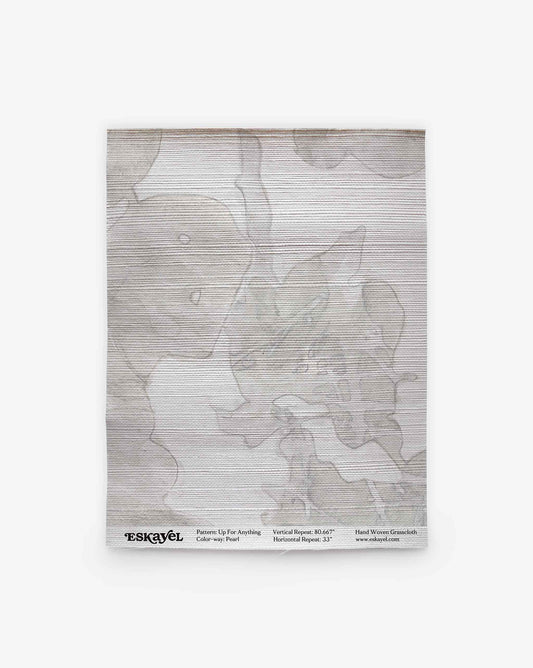 A folded, semi-transparent scarf named “Up for Anything Grasscloth||Pearl” features an abstract botanical pattern with gray shapes and fine horizontal lines. Displayed on a white background, the brand and product details are printed along the bottom edge.