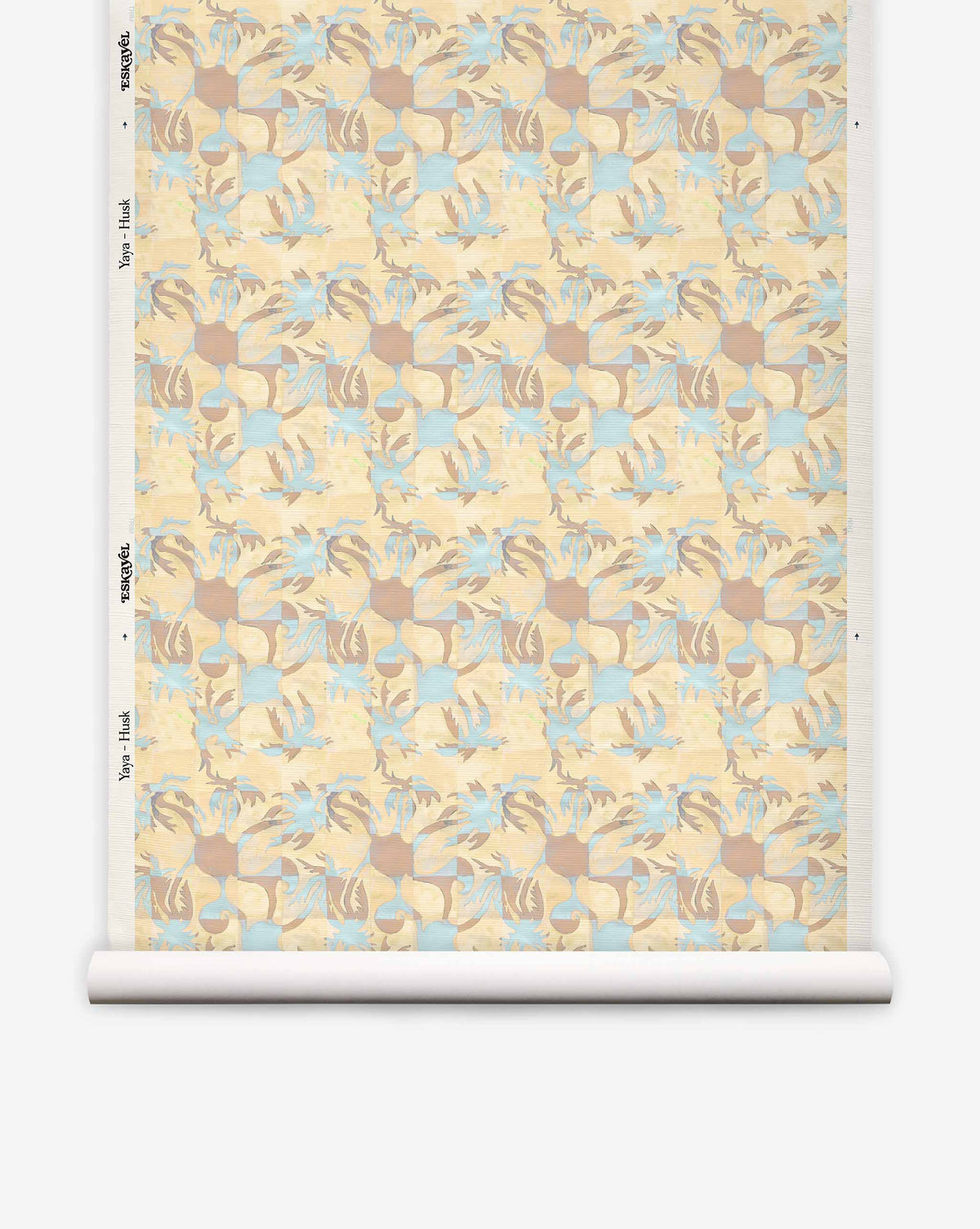 A roll of Yaya Grasscloth||Husk wallpaper featuring a repeating geometric pattern of interlocking tan, light blue, and cream shapes with a textured, hand-woven sisal grasscloth finish.