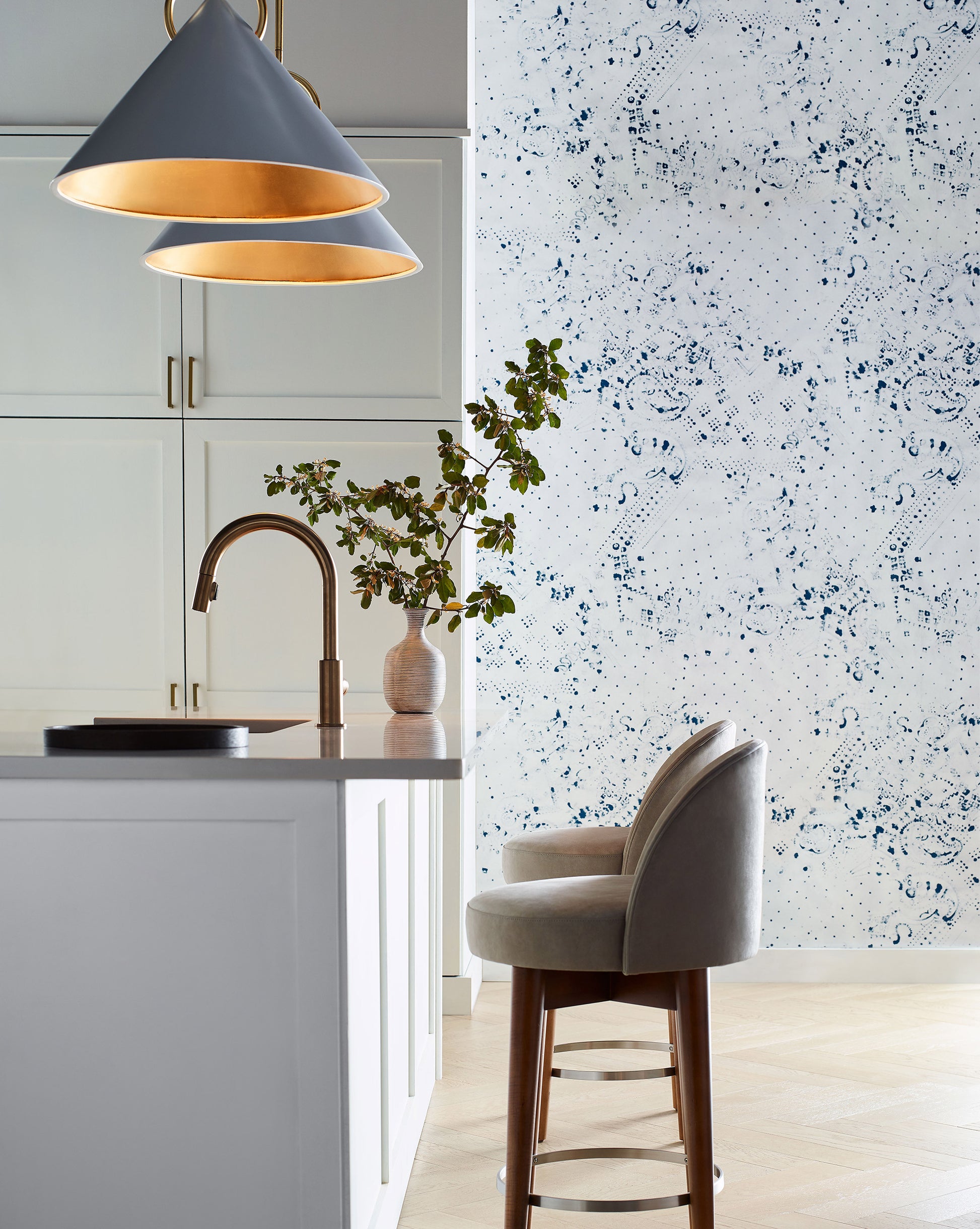 A kitchen with a Bandanarama Wallpaper||Indigo featuring playful polka dots.