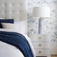 A bedroom with a Dogwood Dreams Wallpaper||Indigo custom luxury wallpaper.