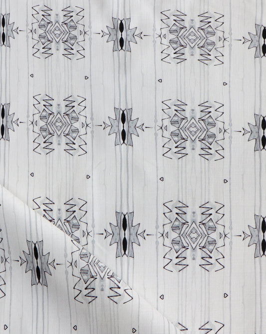A close up of the Akimbo 3 Fabric Greyscale, a versatile monochrome colorway and graphic geometric pattern on a fabric
