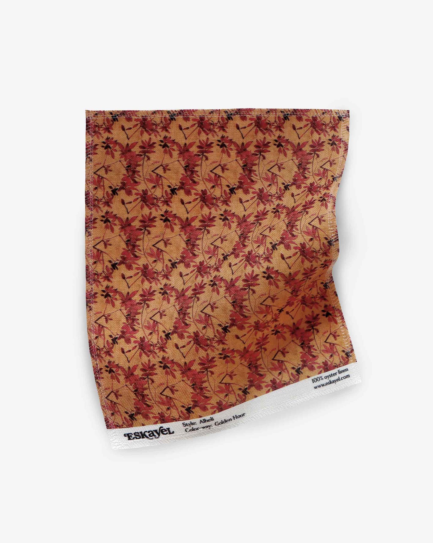 A swatch of Eskayel’s Alhelí, a tiny repeating pattern for fabric, in the orange-based colorway Golden Hour.