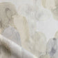 A close up of a white and gray Arcos Fabric Sol with a watercolor pattern