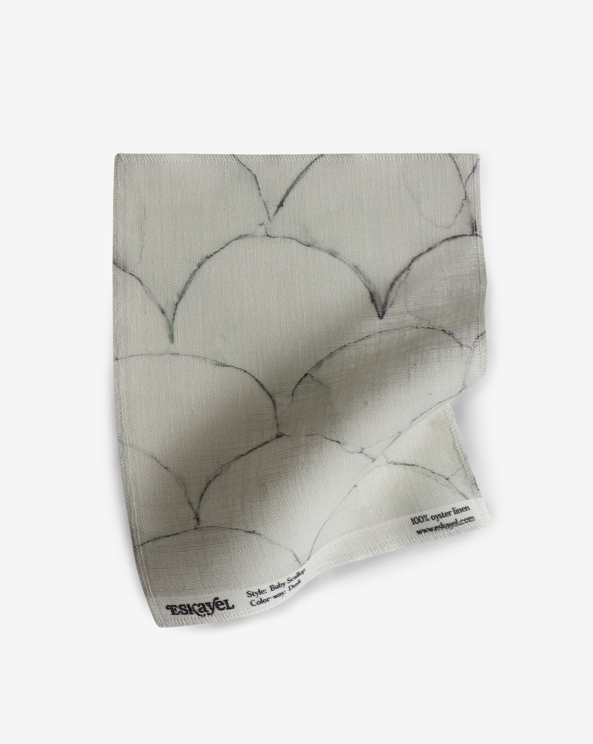 A white Baby Scallop Fabric Dusk fabric with a black and white geometric motif