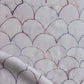 Baby Scallops fabric in Pomegranate introduces tones from mauve to blue into a geometric pattern of overlapping curves.