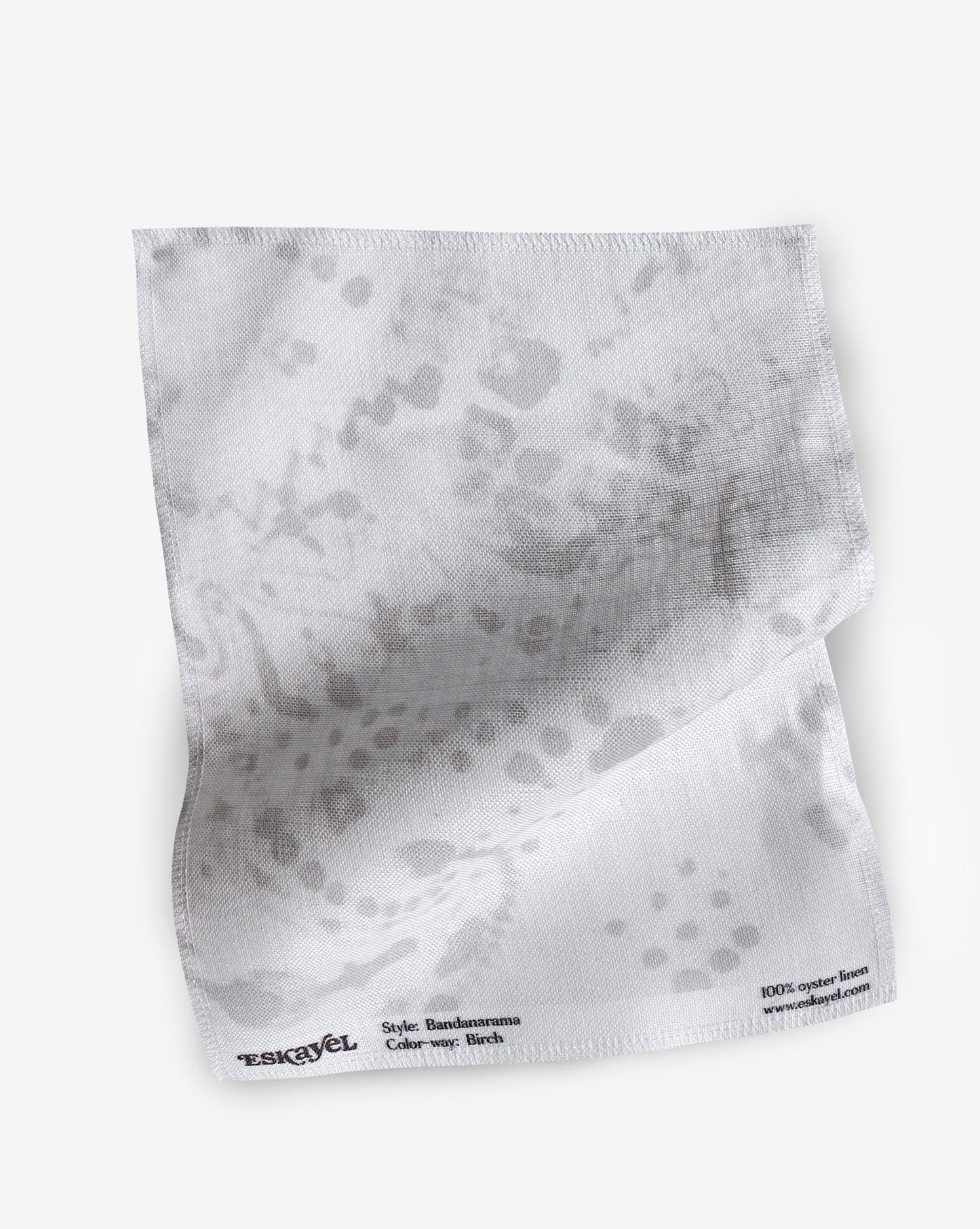 A fabric with our bandanarama pattern featuring a traditional bandana design in light grey and white.