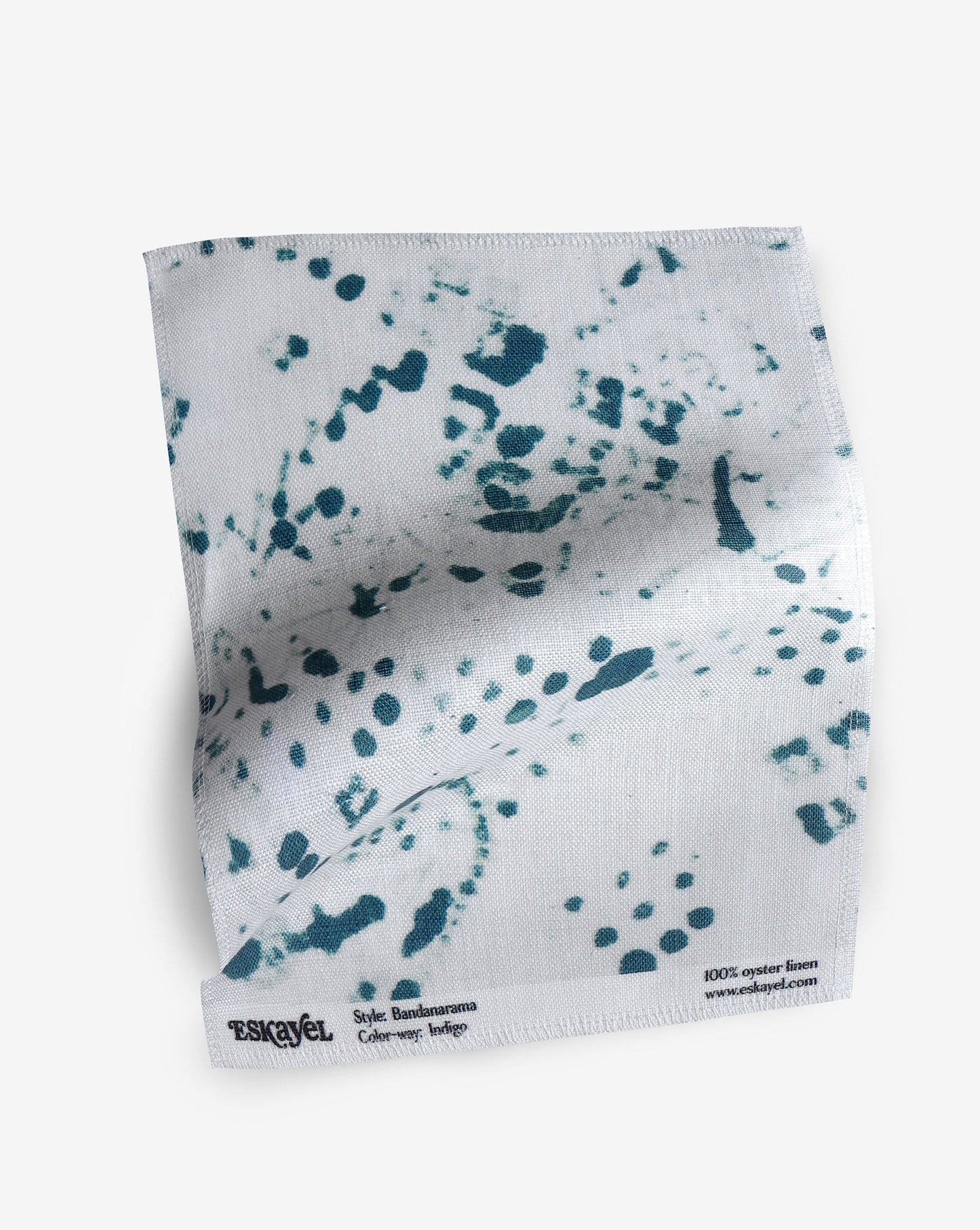 A Bandanarama Fabric Sample||Indigo towel with blue splatters on a white background.