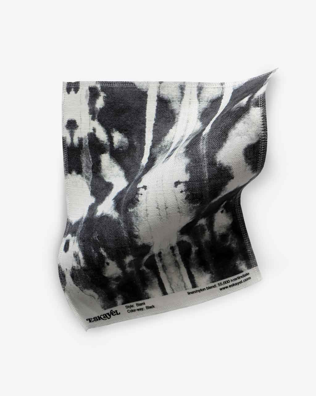 A high-end Biami Fabric||Black towel with a Biami pattern on a white surface.