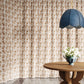 Cascade Garnet fabric in a brown and beige toned pattern used as curtains in a dining room.