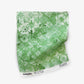 Eskayel’s Crochet Lace fabric swatch in the colorway Arugula is in a green palette of micro-printed flowers. 
