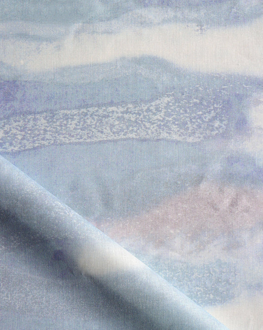 Delta in Moonlight is a fluid fabric print in hues of blue, navy, and beige.