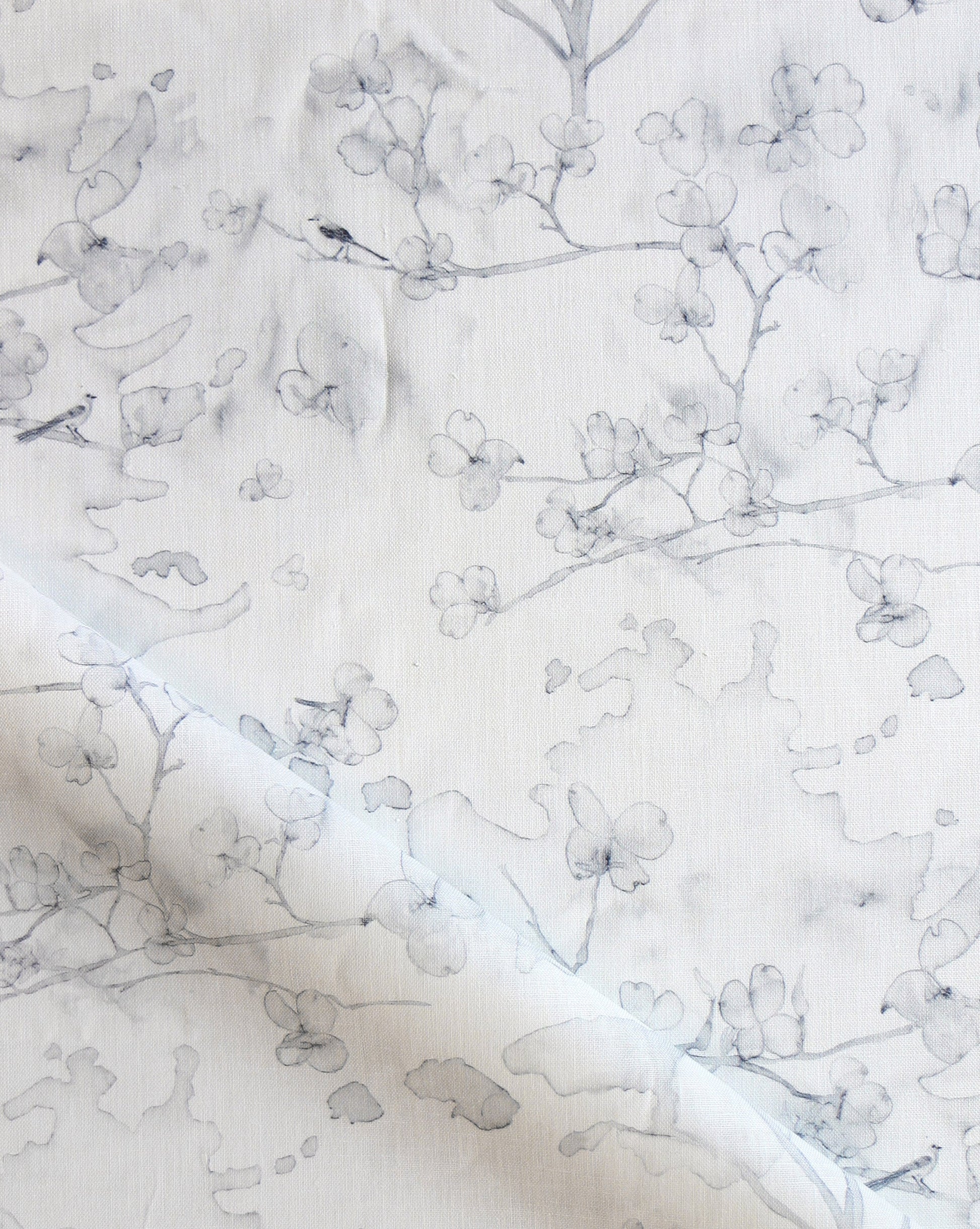 Dogwood Dreams is a watery pattern in pen and ink. As luxury fabric, Birch is a colorway of grey on white.