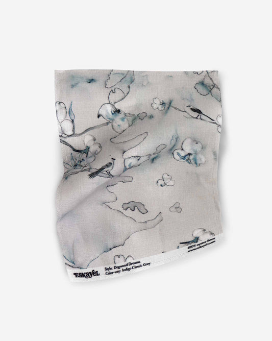 Botanical Dogwood Dreams Indigo Classic Grey Fabric sample with a beige base, grey design and hints of green | Eskayel