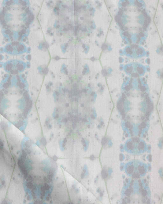 A close up of a blue and white fabric featuring the Hive Fabric Nyanza colorway