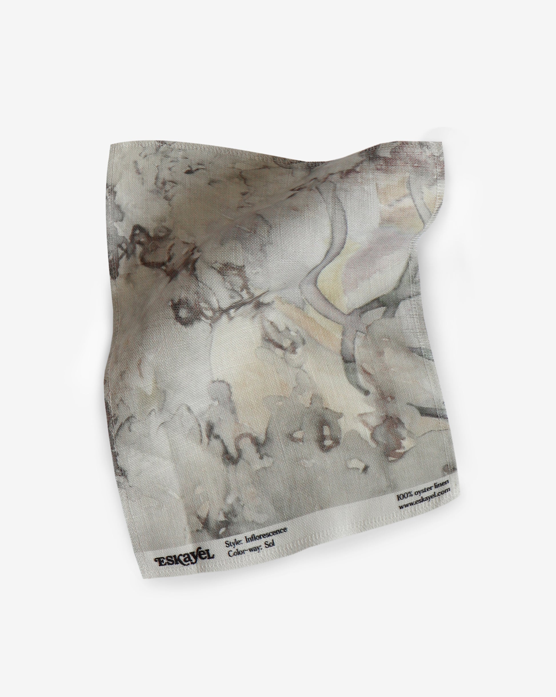 A drawing on a piece of fabric in a neutral Sol colorway showcases an Inflorescence Fabric pattern reminiscent of tropical fabric