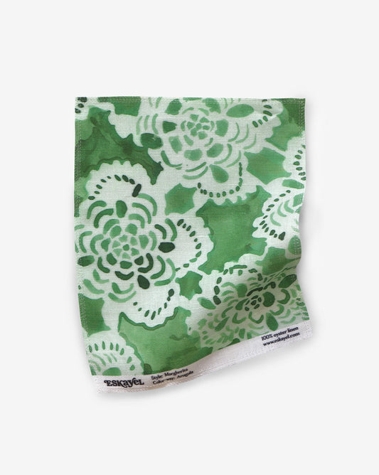 Eskayel’s Margherita fabric swatch in Arugula has  floral shapes in a loose lattice.