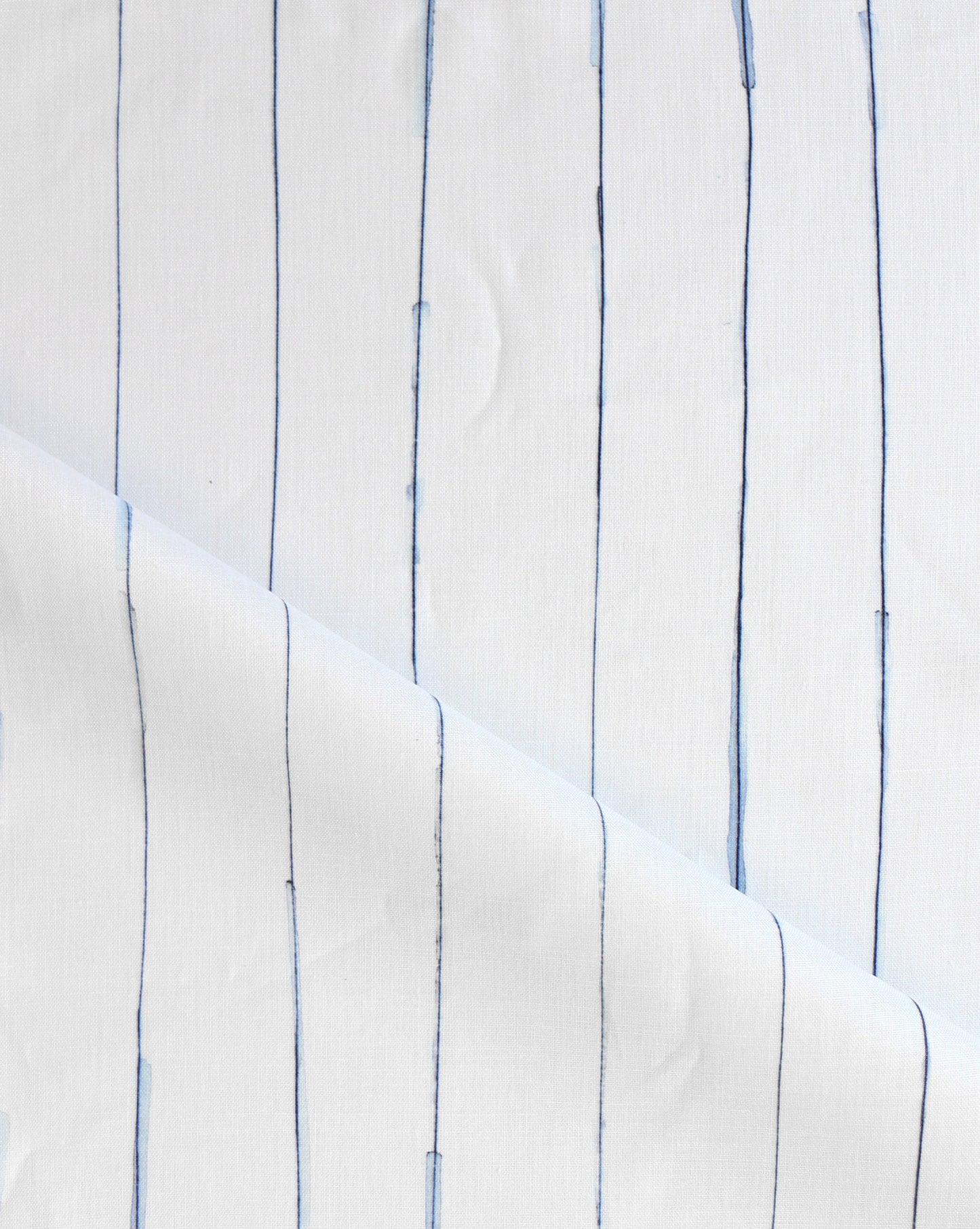 Pen Stripe is an inky riff on classic pinstripes. Made to order as luxury fabric, Indigo is blue on white.