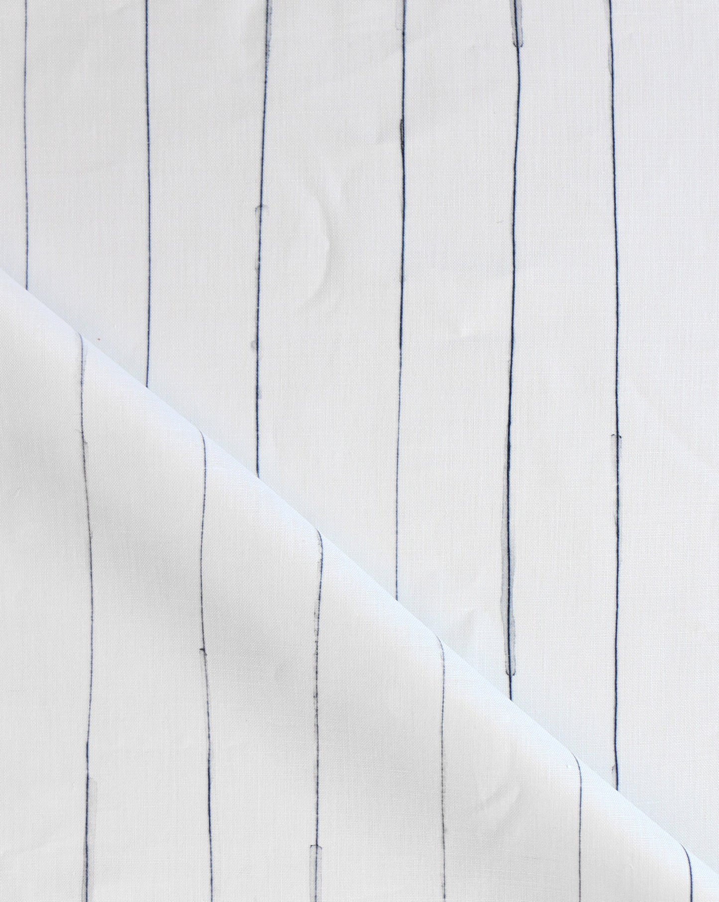 Pen Stripe is a loose riff on traditional pinstripes. Made to order as luxury fabric, Ink is black on white.
