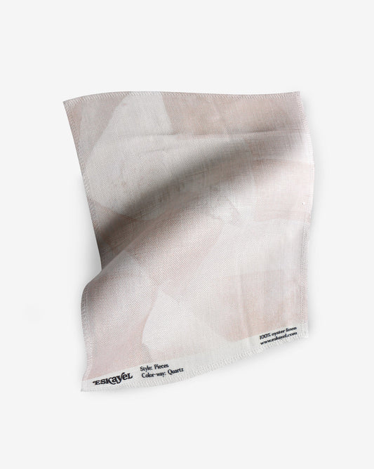 A fabric with our pieces pattern in quartz featuring a color blocked design of puzzle pieces in shades of pink.