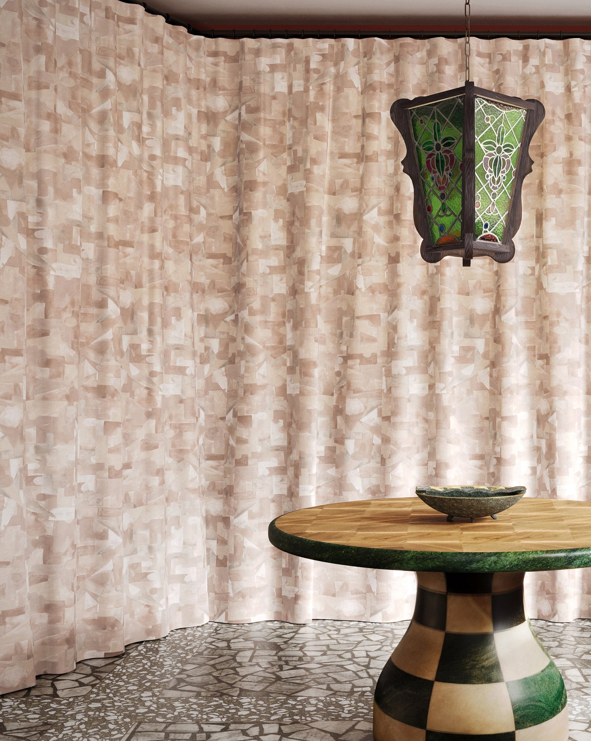Pieces Quartz fabric in a pink hued pattern used as curtains in a dining room.