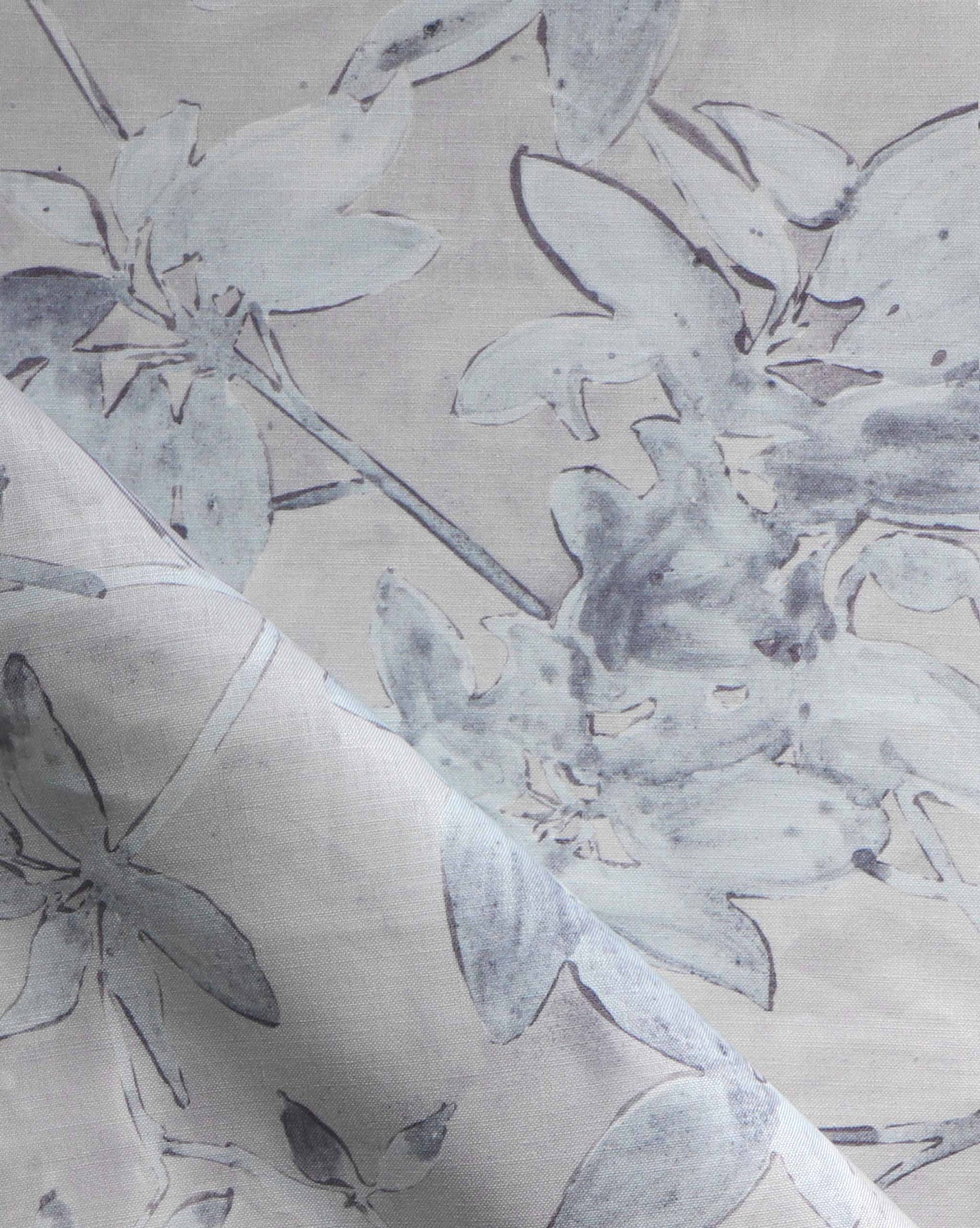 A detail photo of Eskayel’s Plumeria Shadows fabric pattern in the Shadow colorway featuring a grey palette.
