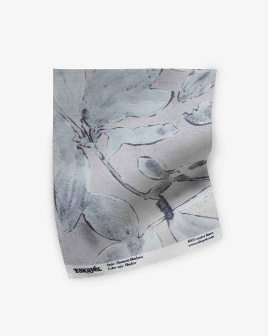 A fabric swatch of Plumeria Shadows in Shadow, a colorway featuring a grey palette | Eskayel