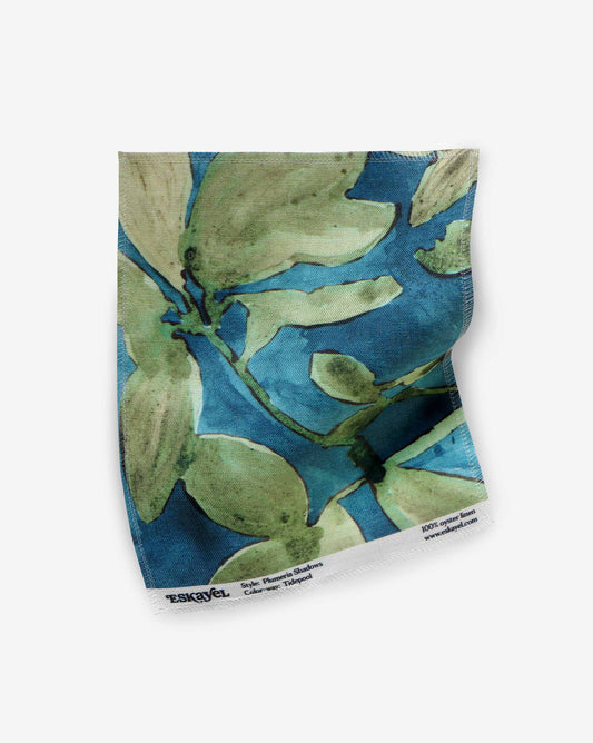 A fabric swatch of Plumeria Shadows in Tide Pool, a colorway featuring a deep blue background | Eskayel