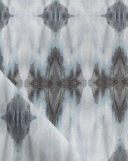 A cerulean Ripple Fabric with a watercolor pattern on it