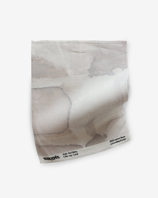 Sea Galaxy Coral Fabric sample is watercolor artwork featuring both intricate and graphic with defined organic shapes in a fluid watercolor style in shades of grey and gentle pink hues | Eskayel