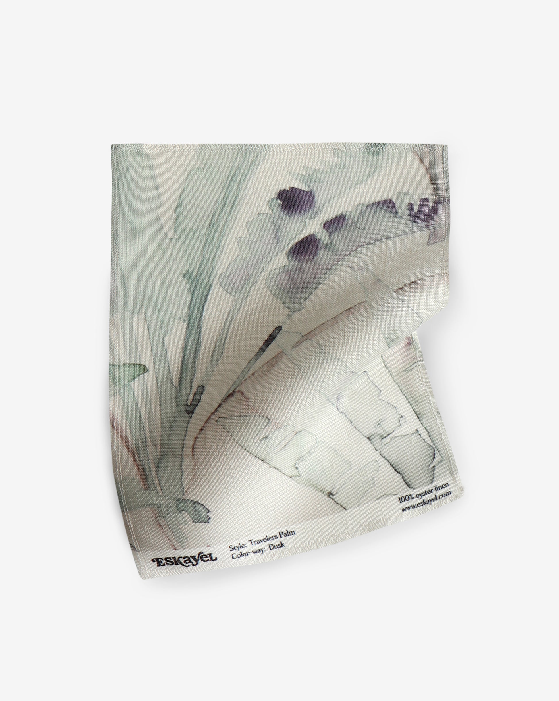 An image of a Travelers Palm Fabric Dusk painting on a piece of fabric, showcasing the delicate strokes and vibrant colors inspired by Travelers Palm