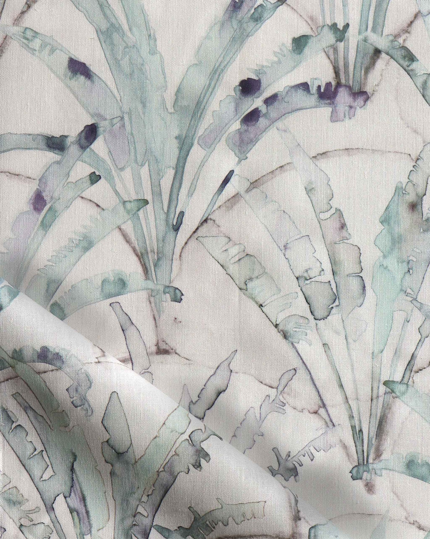 A blue and white Travelers Palm Fabric Dusk, perfect for luxury fabric enthusiasts